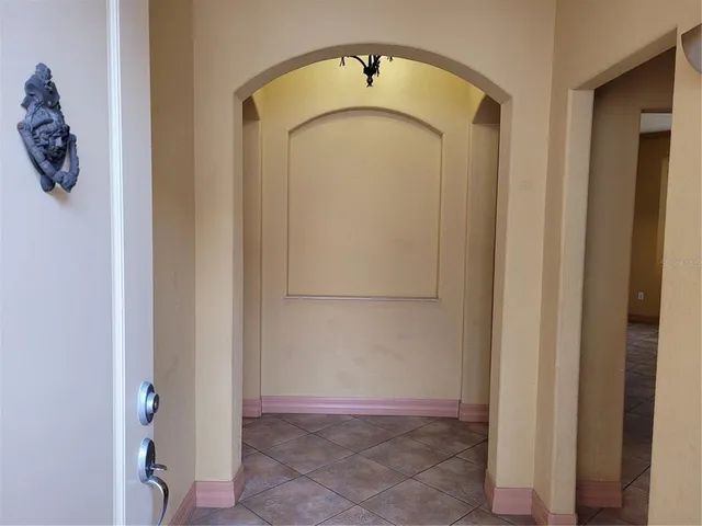 a view of a hallway with entryway