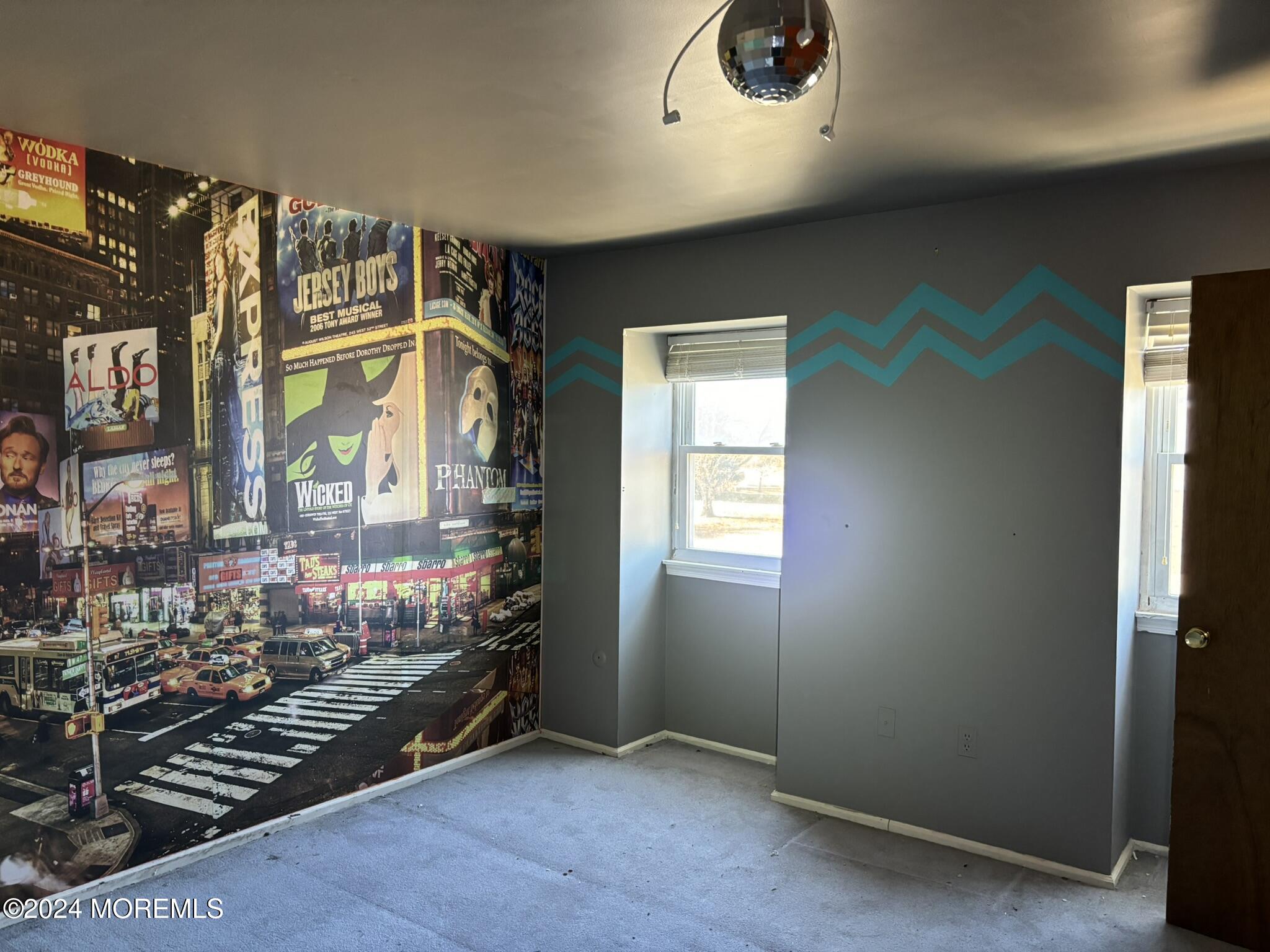 120 Primrose Lane Brick, NJ 08724 - Photo 16 of 21 an empty room with wooden floor and windows