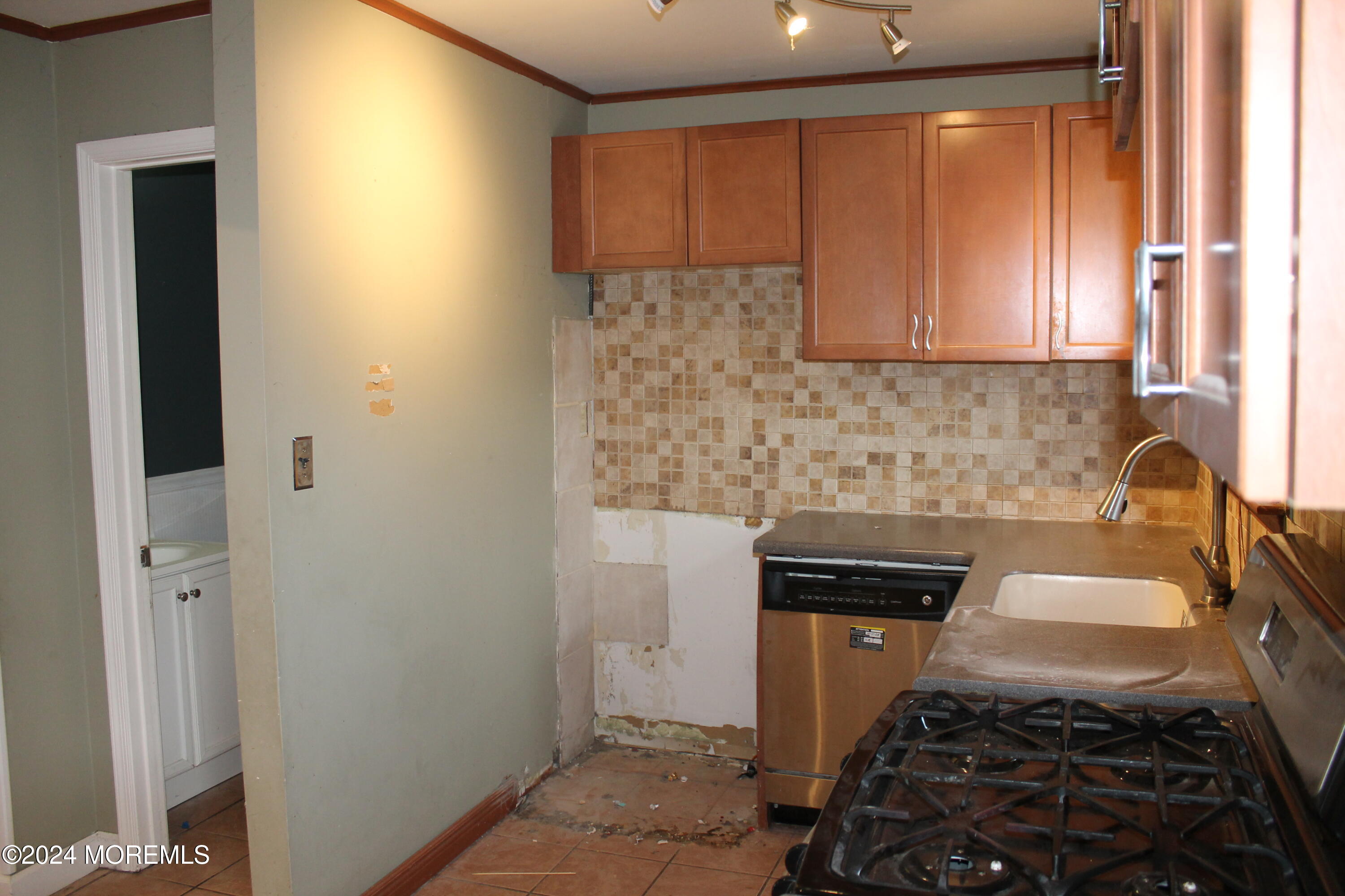 120 Primrose Lane Brick, NJ 08724 - Photo 3 of 21 a kitchen with a sink and a stove top oven