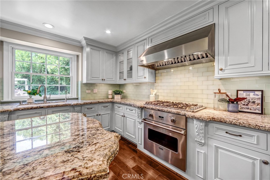1665 Lorain Road San Marino, CA 91108 - Photo 17 of 45 a kitchen with stainless steel appliances granite countertop a stove and a sink