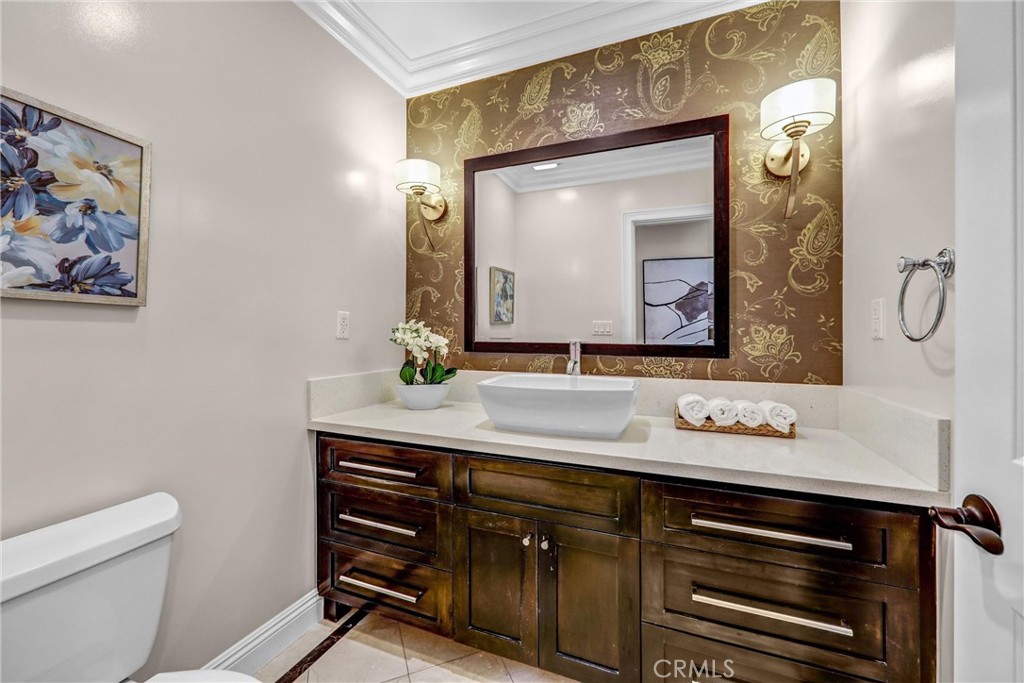 1665 Lorain Road San Marino, CA 91108 - Photo 22 of 45 a bathroom with a sink a mirror and a toilet