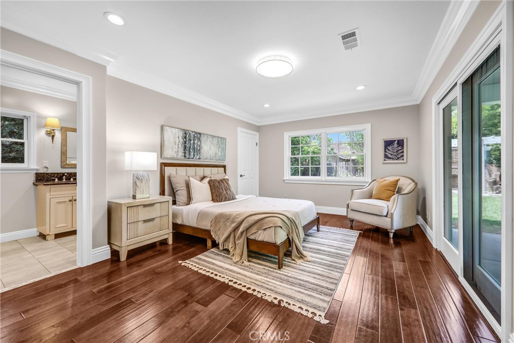 1665 Lorain Road San Marino, CA 91108 - Photo 23 of 45 a spacious bedroom with a bed and wooden floor