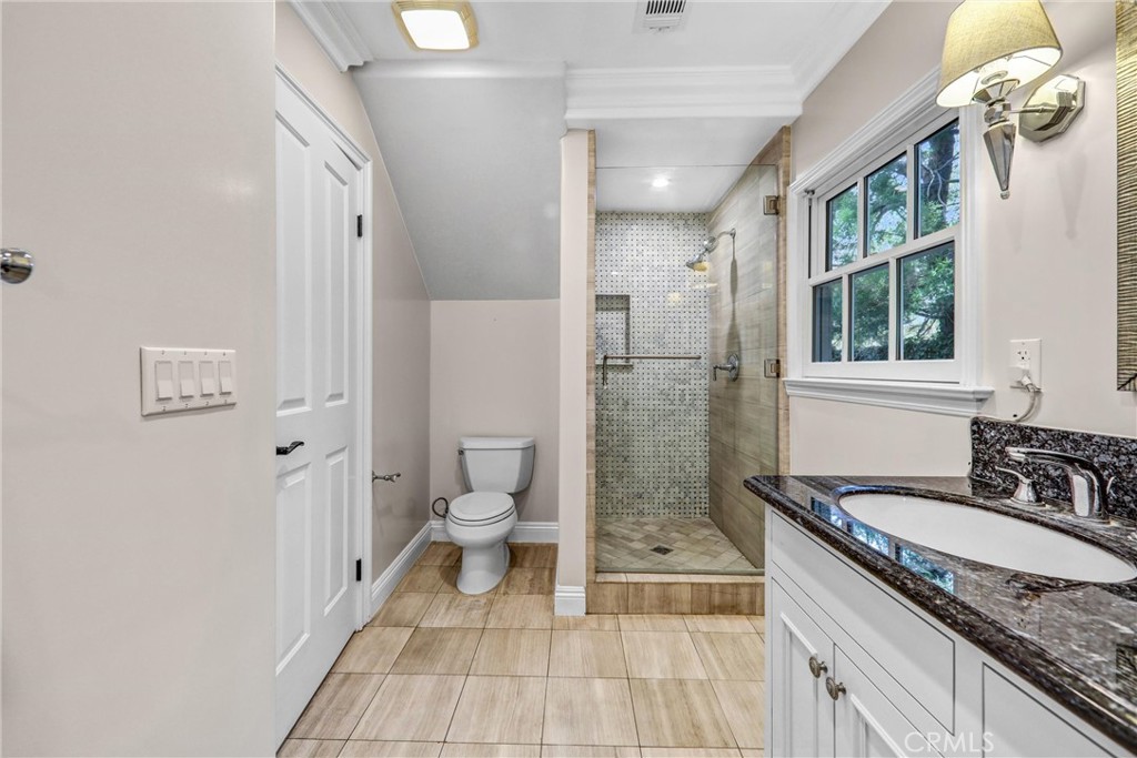 1665 Lorain Road San Marino, CA 91108 - Photo 25 of 45 a spacious bathroom with a granite countertop sink a toilet and a shower