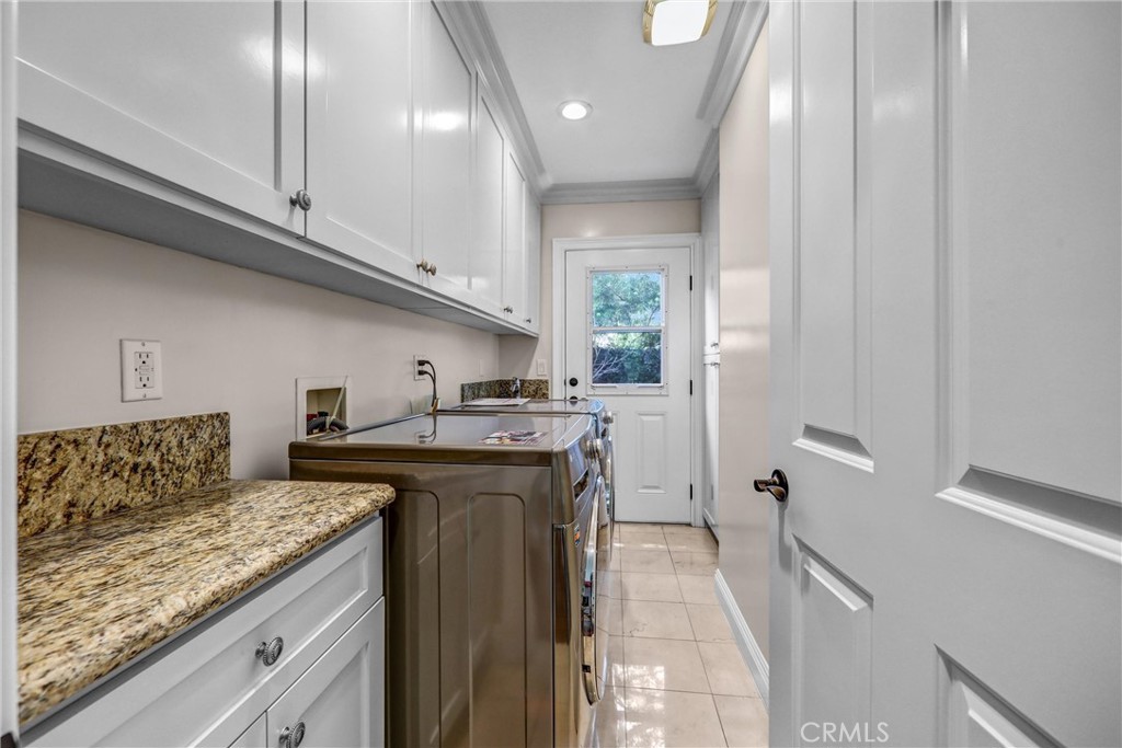 1665 Lorain Road San Marino, CA 91108 - Photo 27 of 45 a kitchen with stainless steel appliances granite countertop a sink stove and refrigerator