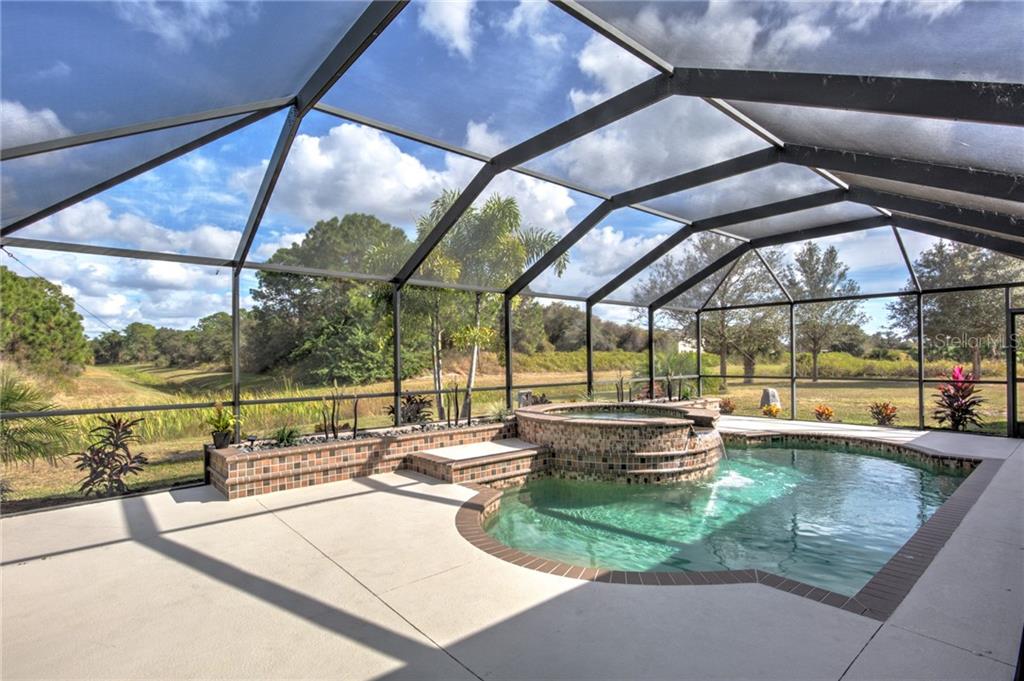 6612 Deer Run Road North Port, FL 34291 - Photo 17 of 25 View from pool across the greenbelt to the extra vacant lot