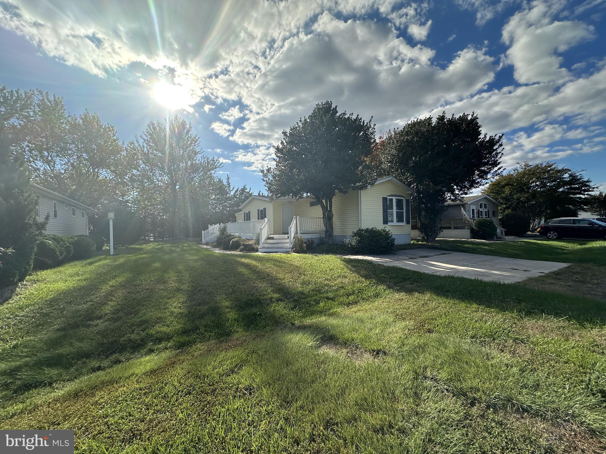 18656 Snowmass Run, Unit 18656 Rehoboth Beach, DE 19971 - Photo 1 of 14 a backyard of a house with lots of green space