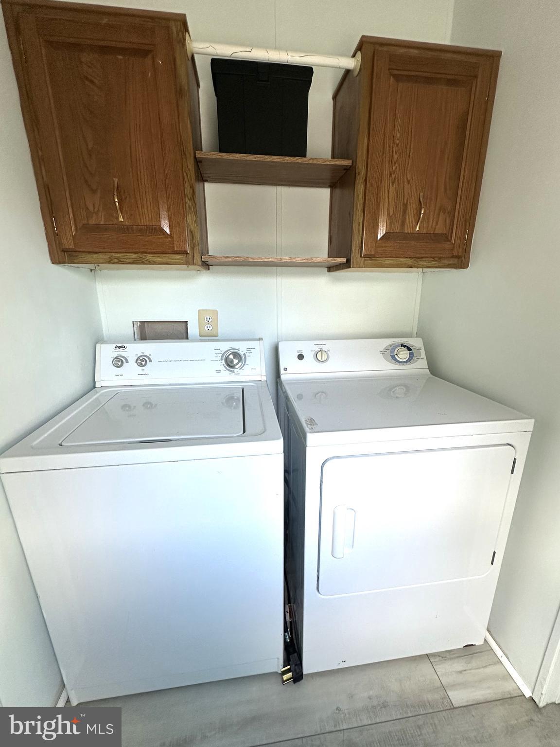 18656 Snowmass Run, Unit 18656 Rehoboth Beach, DE 19971 - Photo 6 of 14 a utility room with dryer and washer