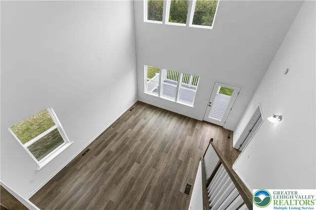 a view of an entryway with wooden floor