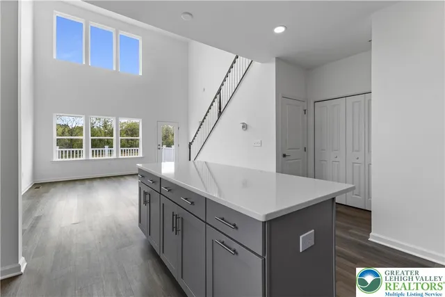 a view of an entryway with wooden floor and stairs