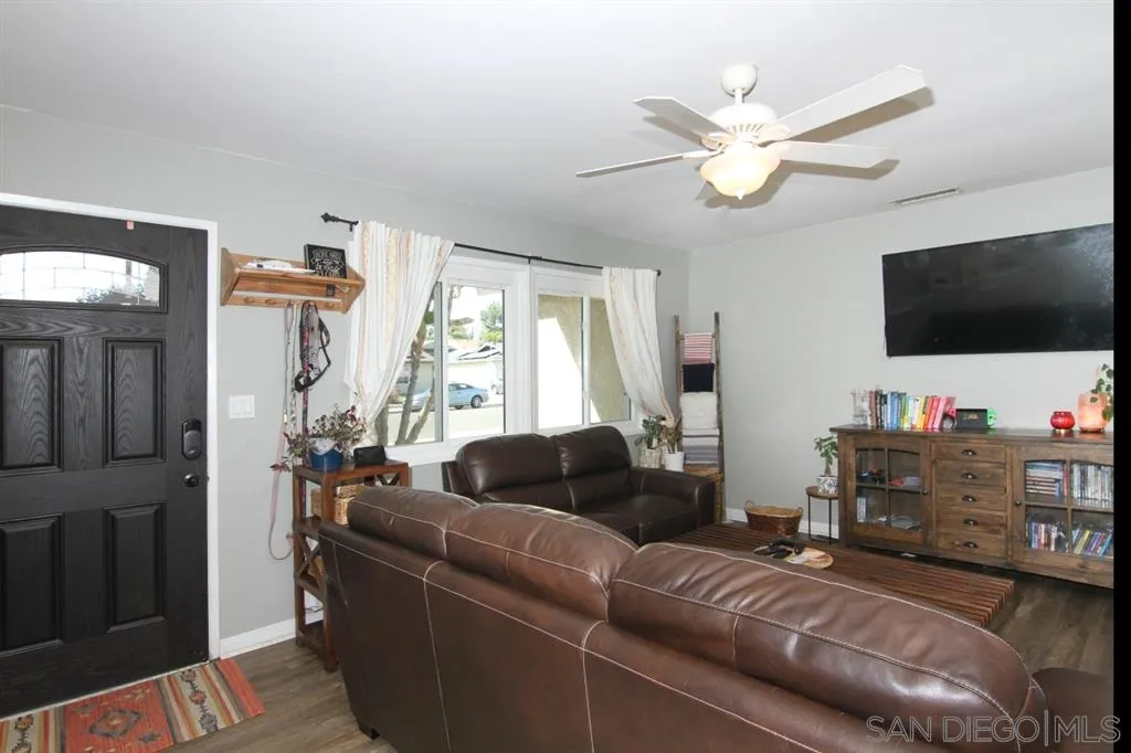 9225 Carita Road Santee, CA 92071 - Photo 4 of 24 a living room with furniture and a flat screen tv
