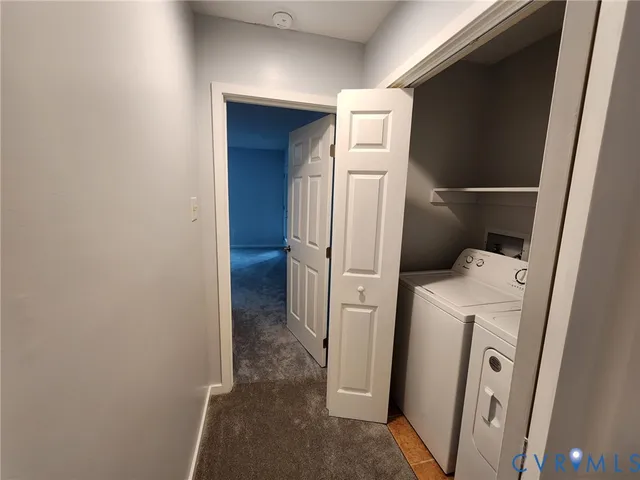a view of storage and utility room with washer and dryer