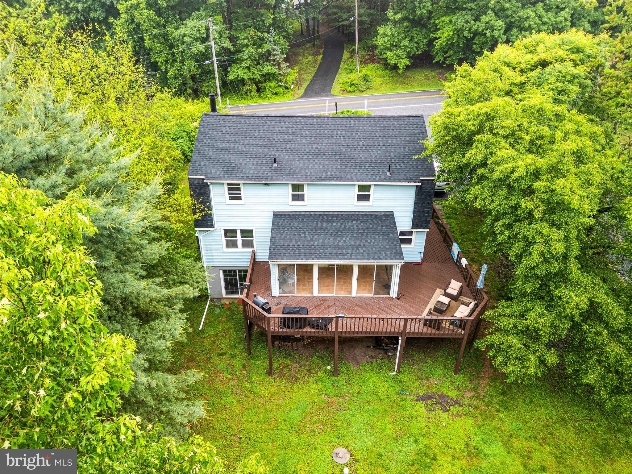 4217 Bill Moxley Road Mount Airy, MD 21771 - Photo 51 of 57 an aerial view of a house with swimming pool and large trees