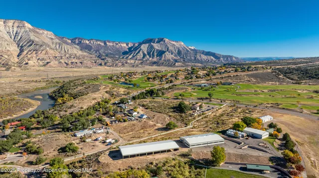 a view of a parking area with lots of bushes