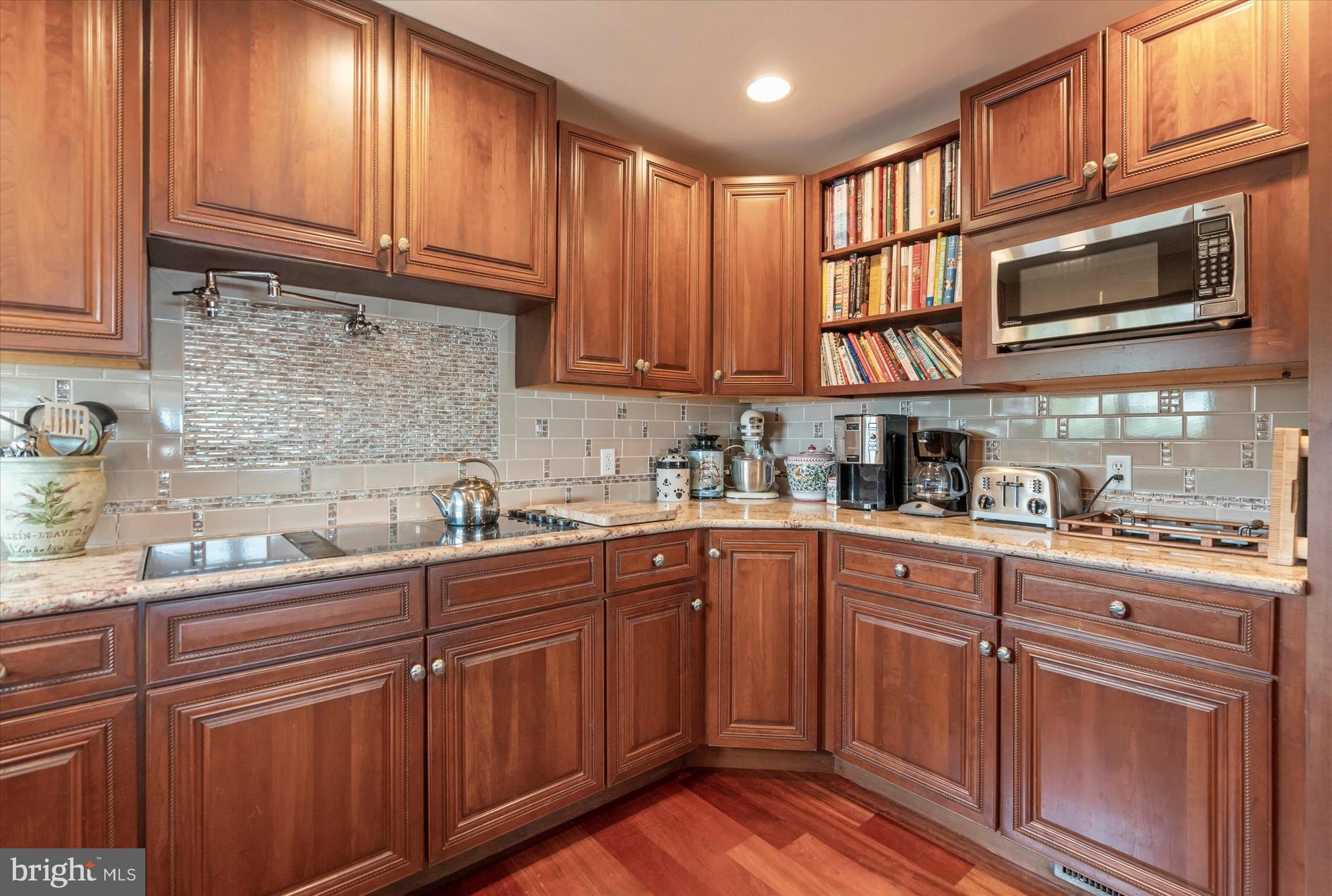 10 Pilot Point, Unit 10B Lewes, DE 19958 - Photo 13 of 38 a kitchen with stainless steel appliances granite countertop a sink and cabinets