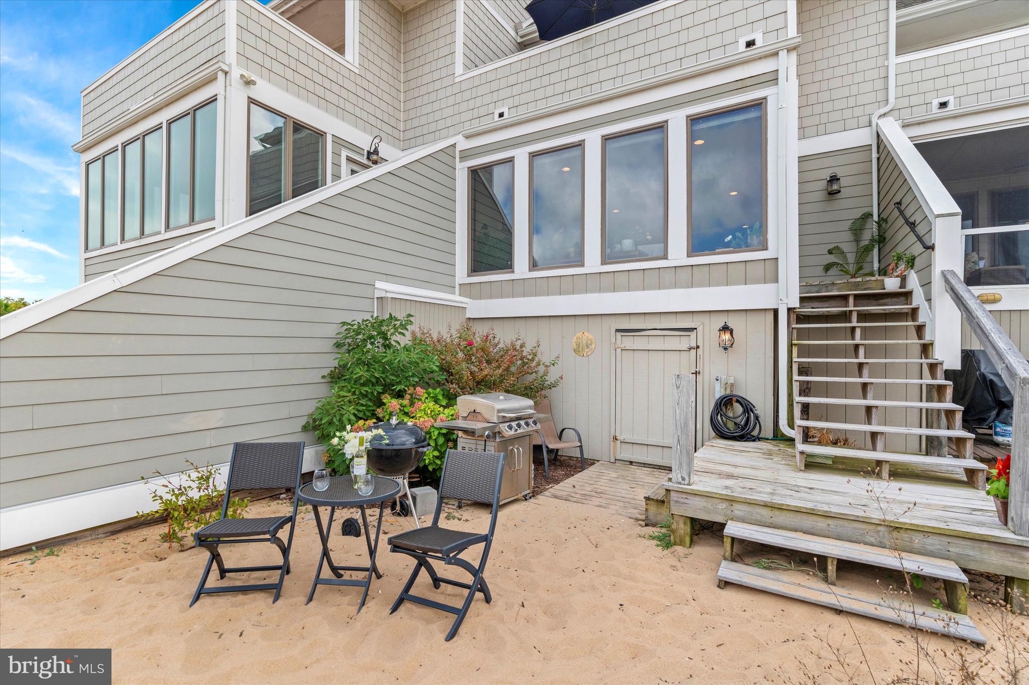 10 Pilot Point, Unit 10B Lewes, DE 19958 - Photo 31 of 38 a backyard of a house with outdoor seating