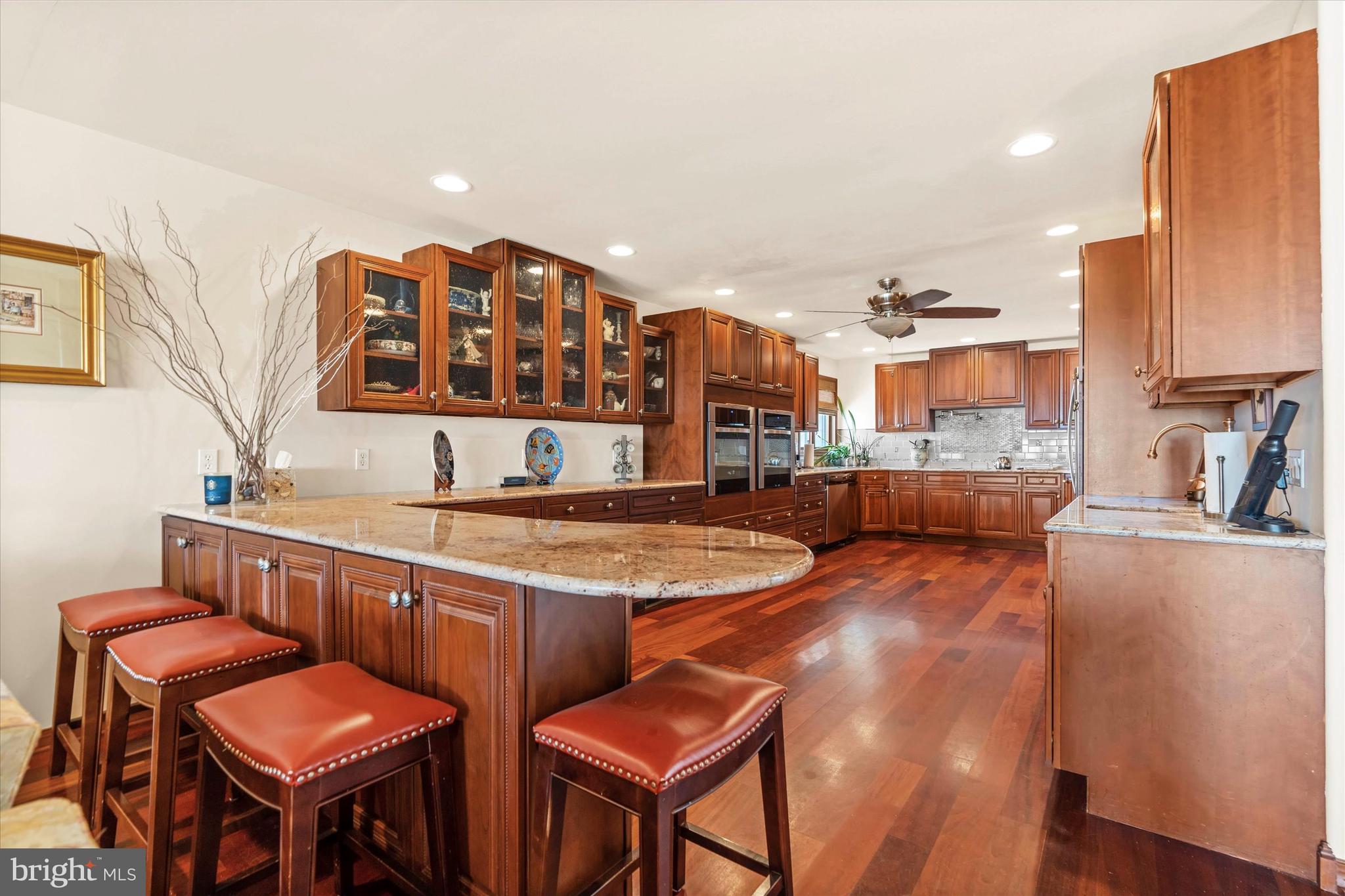10 Pilot Point, Unit 10B Lewes, DE 19958 - Photo 10 of 38 a living room with stainless steel appliances furniture a couch and a kitchen view