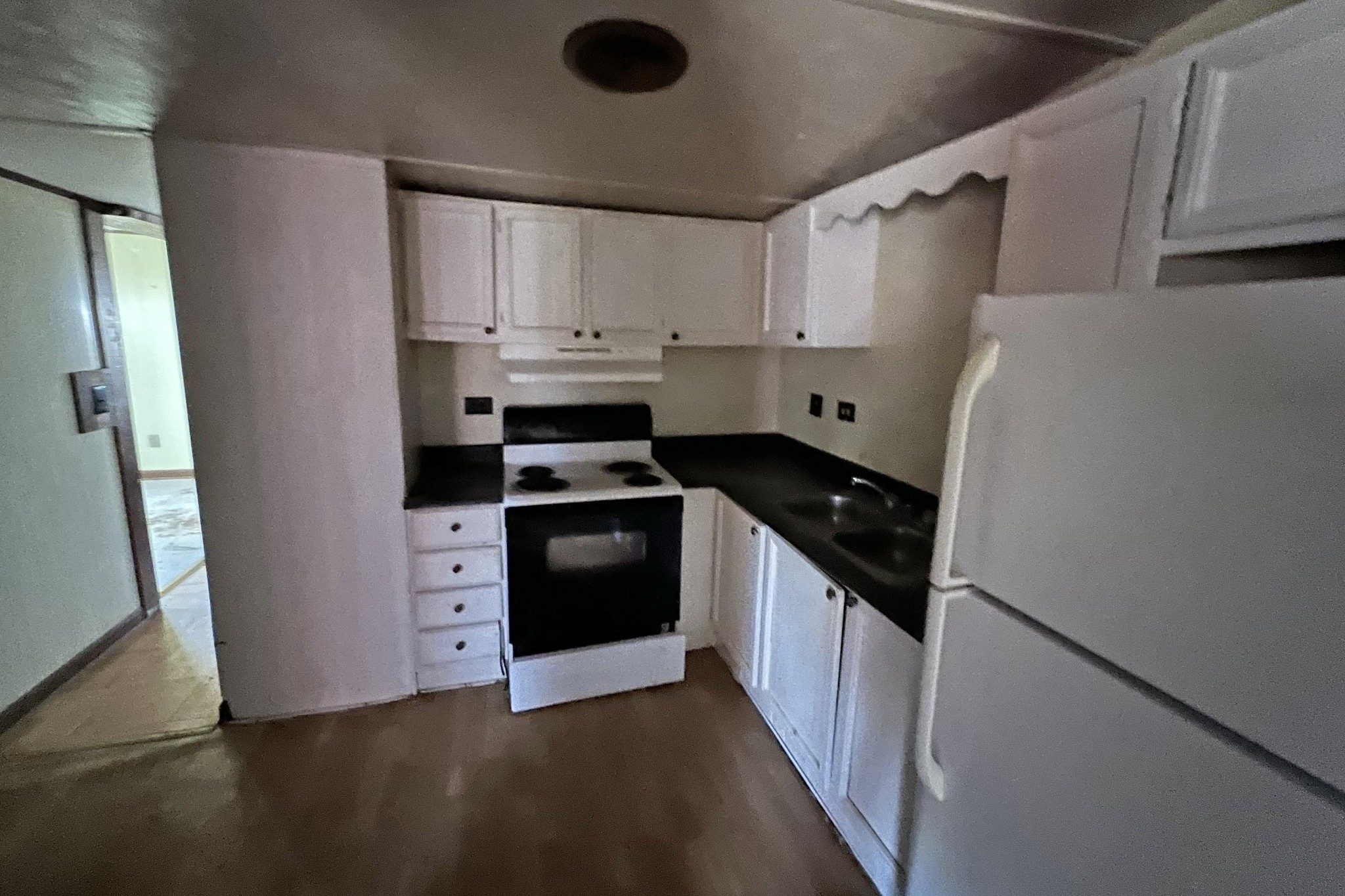 709 Calvert Road Adolphus, KY 42120 - Photo 5 of 19 a kitchen with stainless steel appliances a refrigerator sink and stove