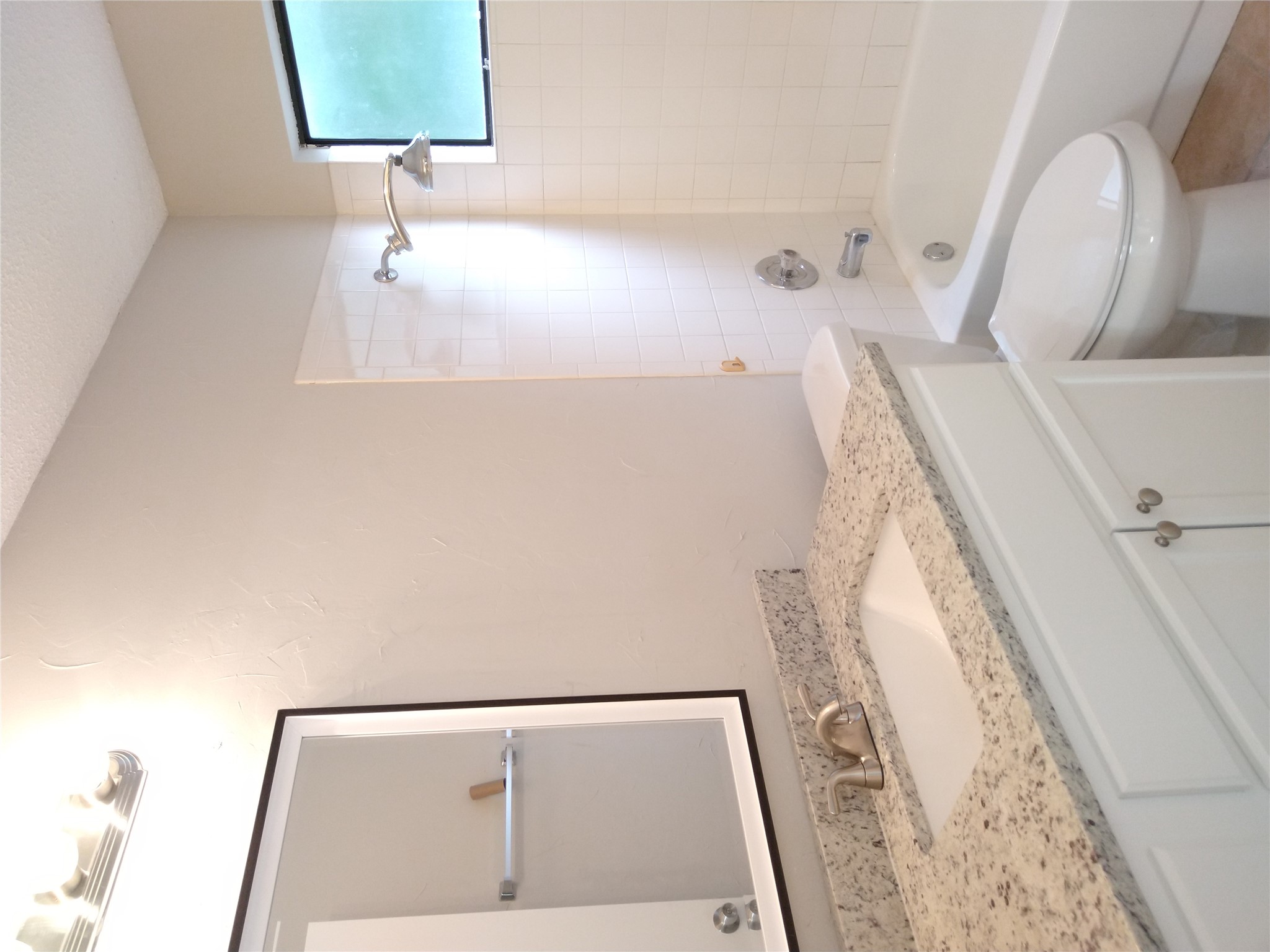1813 Laurel Path Round Rock, TX 78664 - Photo 18 of 35 A well-appointed bathroom offers a crisp vanity and a shower-tub combination.