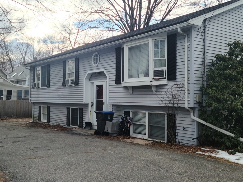 17 Harvard Street Natick, MA 01760 - Photo 2 of 12 a front view of a house with garage