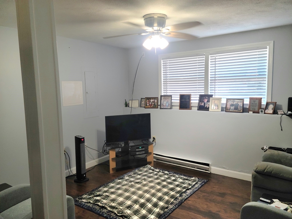 17 Harvard Street Natick, MA 01760 - Photo 5 of 12 a room with furniture and a window