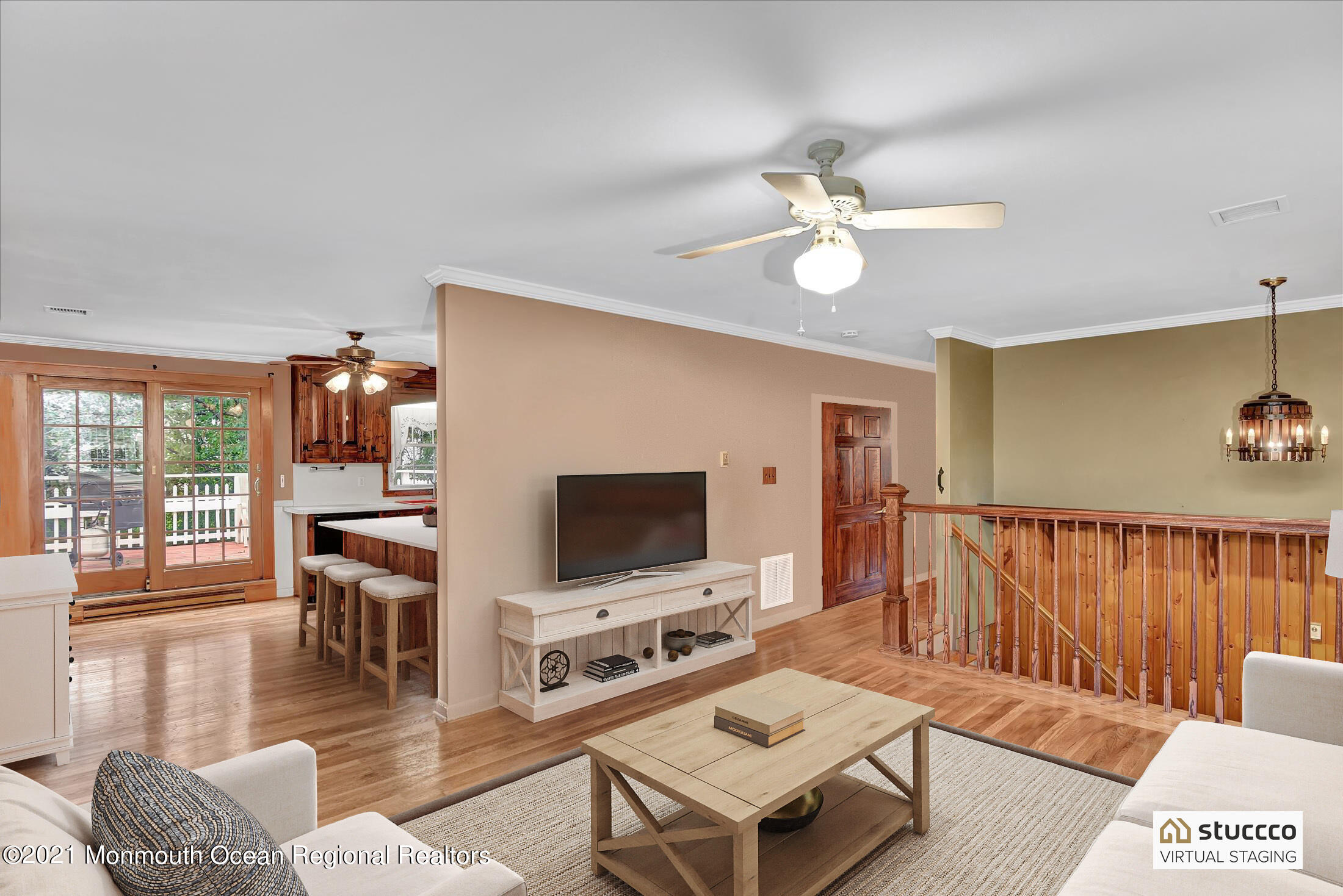 149 Crine Road Morganville, NJ 07751 - Photo 17 of 28 a living room with furniture a flat screen tv and floor to ceiling window