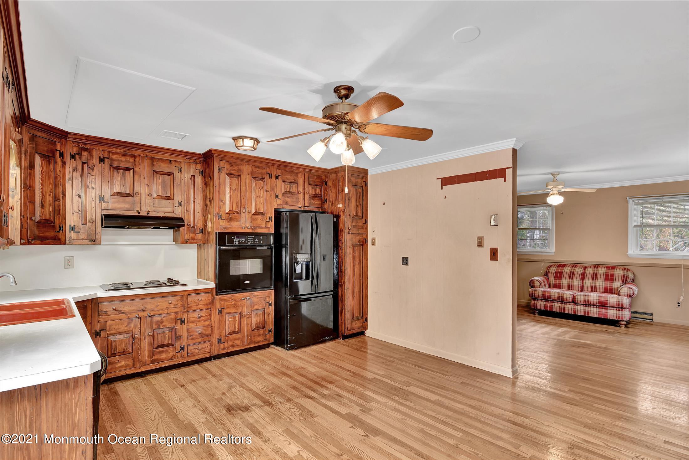 149 Crine Road Morganville, NJ 07751 - Photo 6 of 28 a bedroom with furniture and window