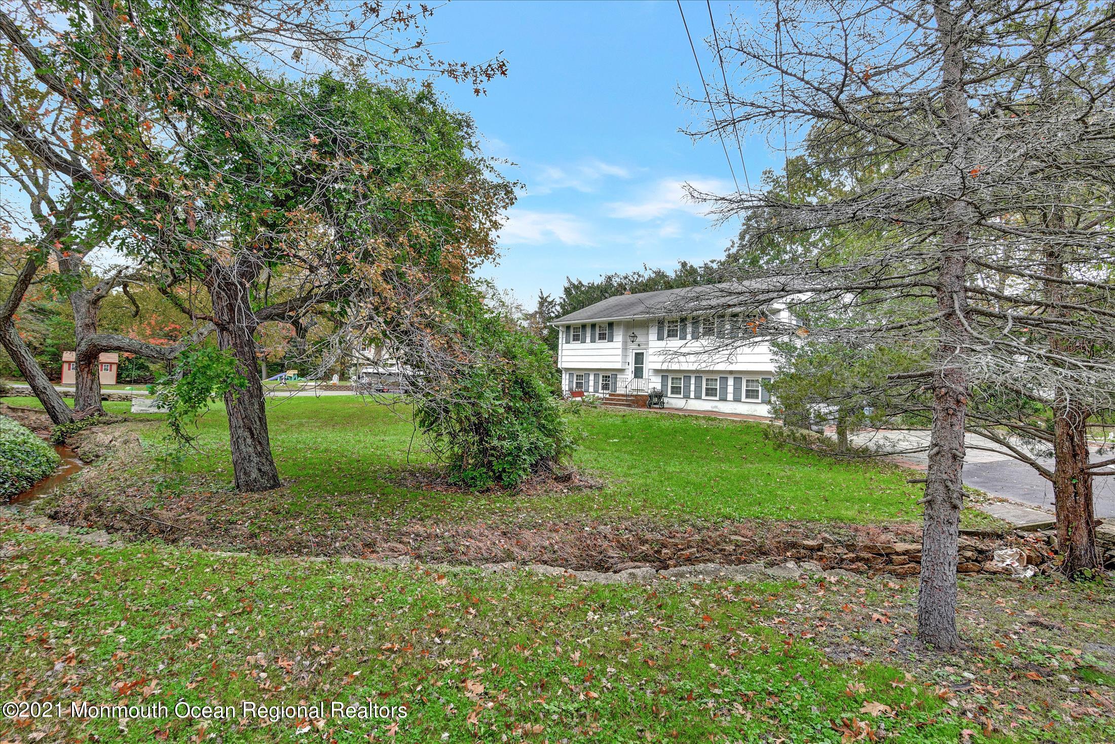 149 Crine Road Morganville, NJ 07751 - Photo 8 of 28 a view of a house with backyard and garden