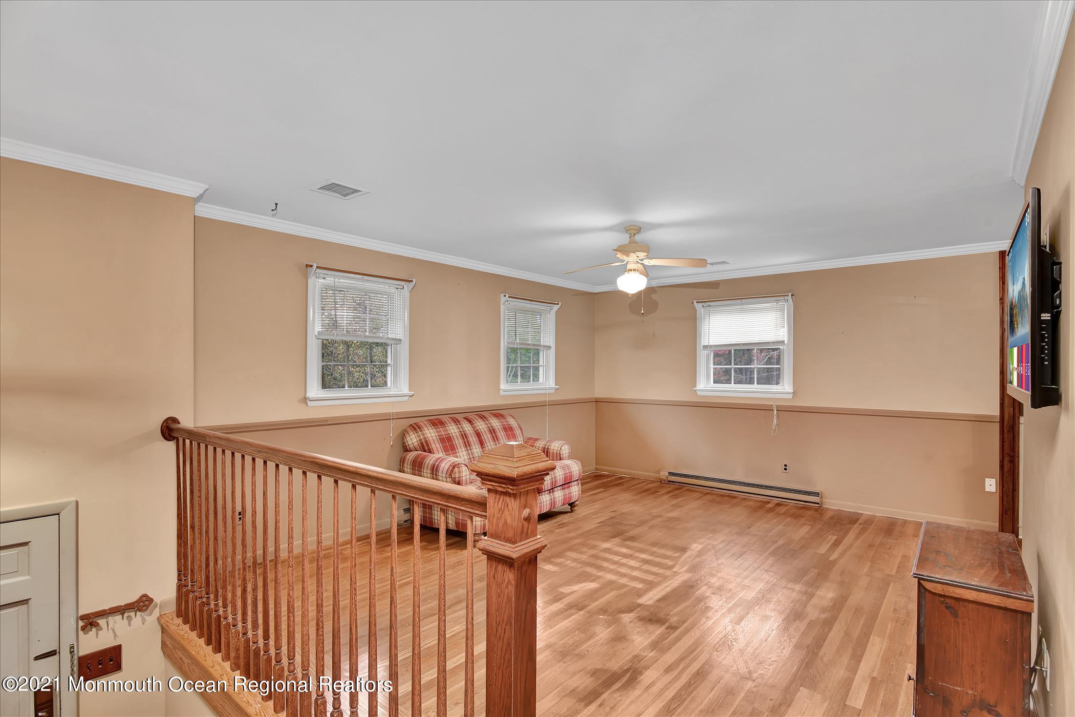 149 Crine Road Morganville, NJ 07751 - Photo 9 of 28 a view of an empty room with a window