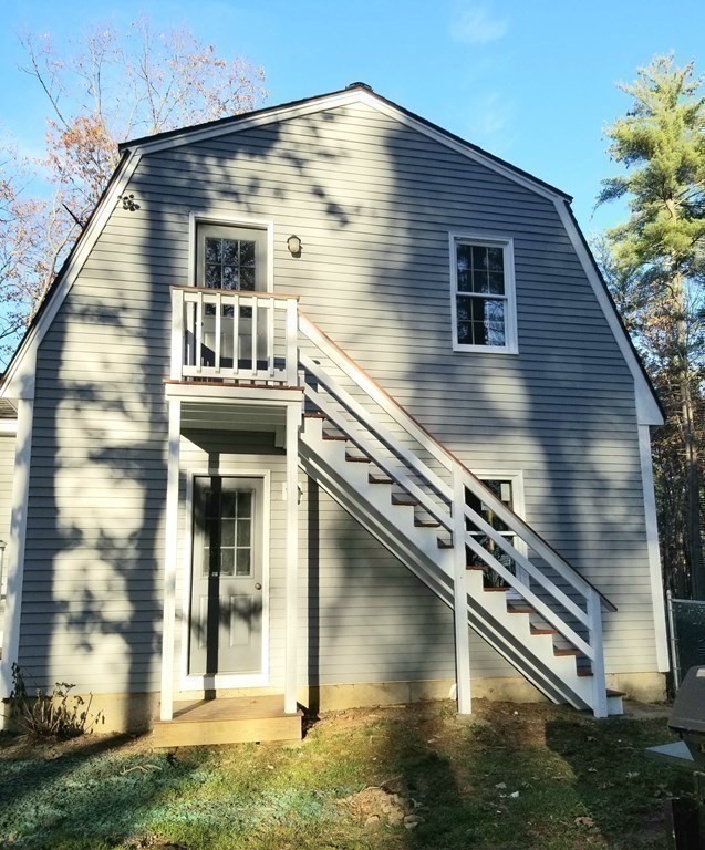 22 Whitney Road Shirley, MA 01464 - Photo 30 of 42 a front view of a house with a yard