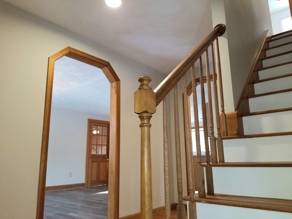 22 Whitney Road Shirley, MA 01464 - Photo 3 of 42 a view of an entryway with staircase