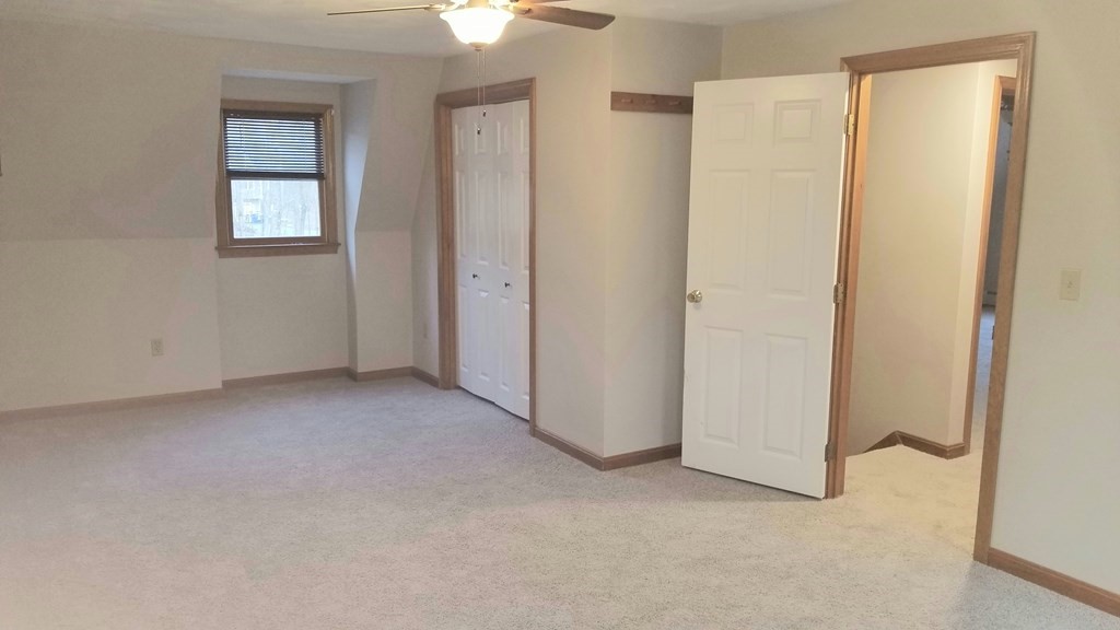 22 Whitney Road Shirley, MA 01464 - Photo 40 of 42 a view of an empty room with windows and closet