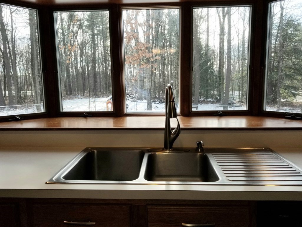 22 Whitney Road Shirley, MA 01464 - Photo 6 of 42 a kitchen with a sink and large window