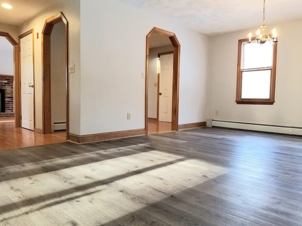 22 Whitney Road Shirley, MA 01464 - Photo 9 of 42 a view of a room with wooden floor and window