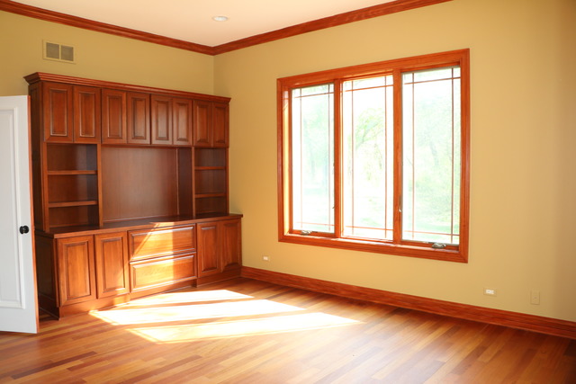195 Bateman Road Barrington Hills, IL 60010 - Photo 11 of 23 an empty room with wooden floor and windows