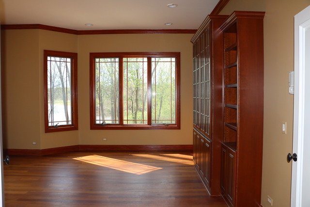 195 Bateman Road Barrington Hills, IL 60010 - Photo 12 of 23 an empty room with wooden floor and windows