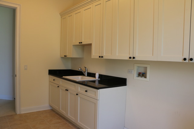 195 Bateman Road Barrington Hills, IL 60010 - Photo 13 of 23 a kitchen with stainless steel appliances granite countertop a sink and dishwasher with white cabinets