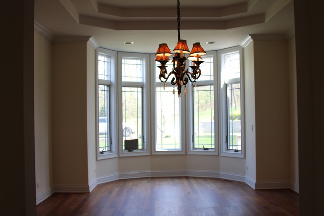 195 Bateman Road Barrington Hills, IL 60010 - Photo 7 of 23 a view of a room with wooden floor and windows