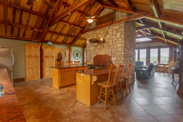 a bedroom with a bed couch and a window