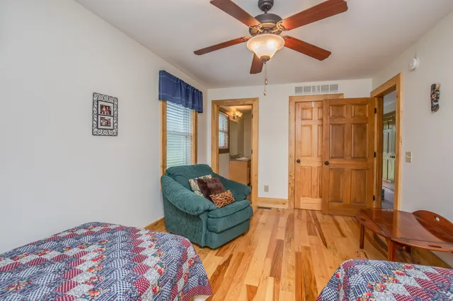 a bathroom with a shower a toilet and a shower