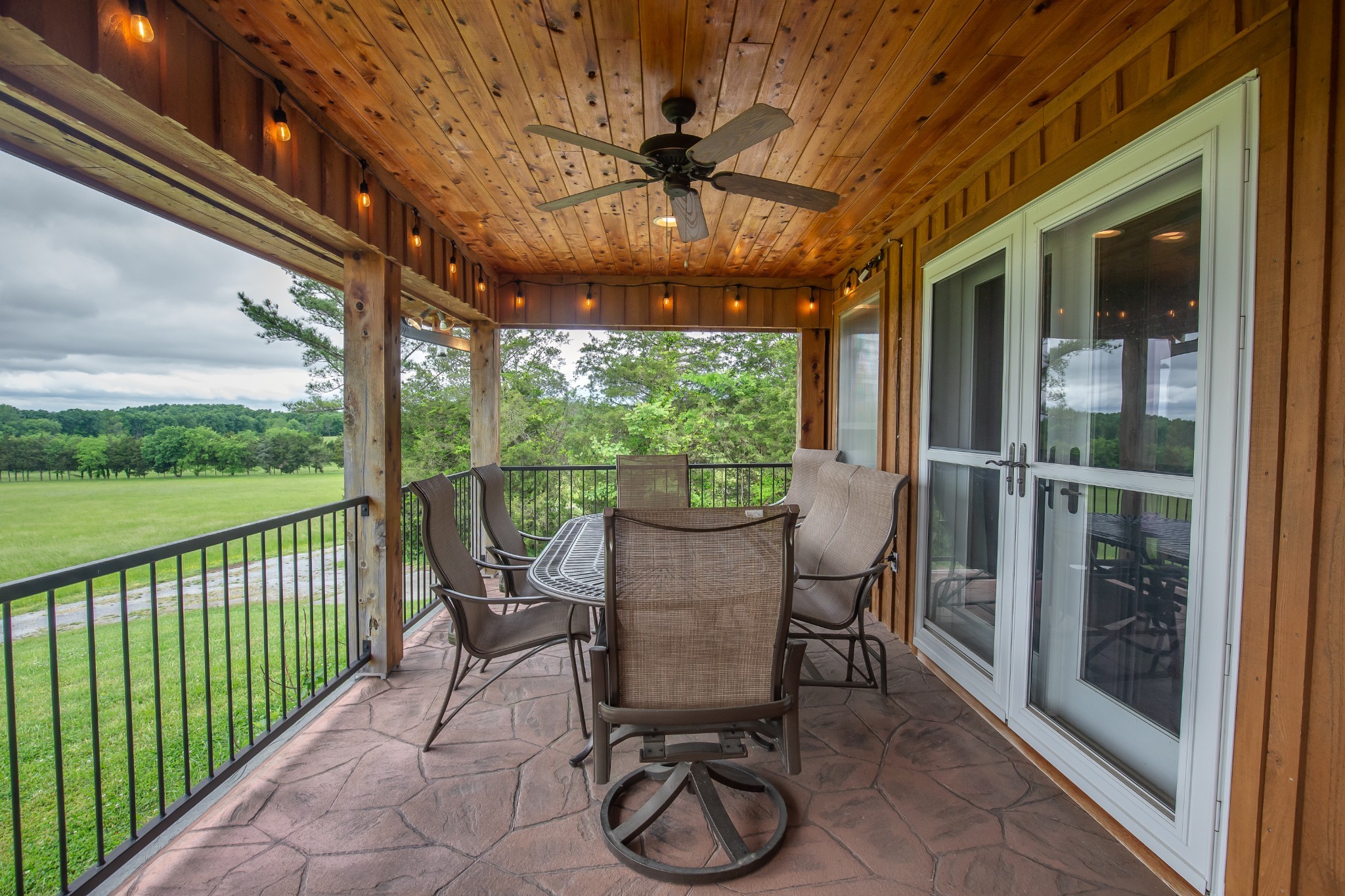 521 Coop Road Bell Buckle, TN 37020 - Photo 57 of 63 a view of a porch with furniture and a yard