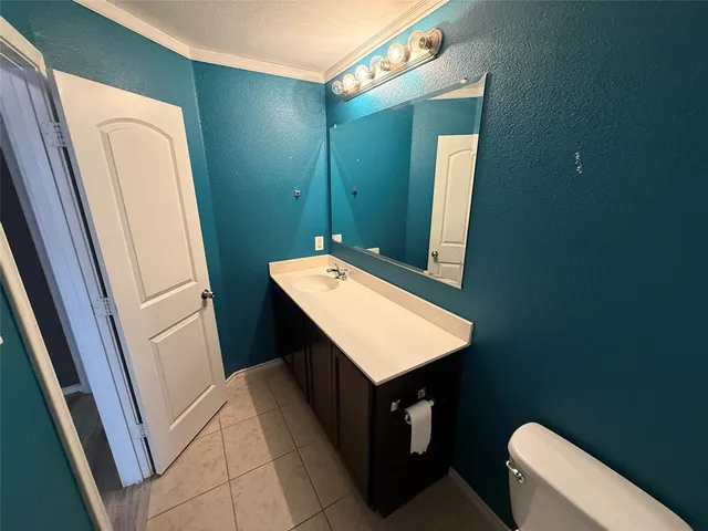 a bathroom with a sink a mirror and toilet