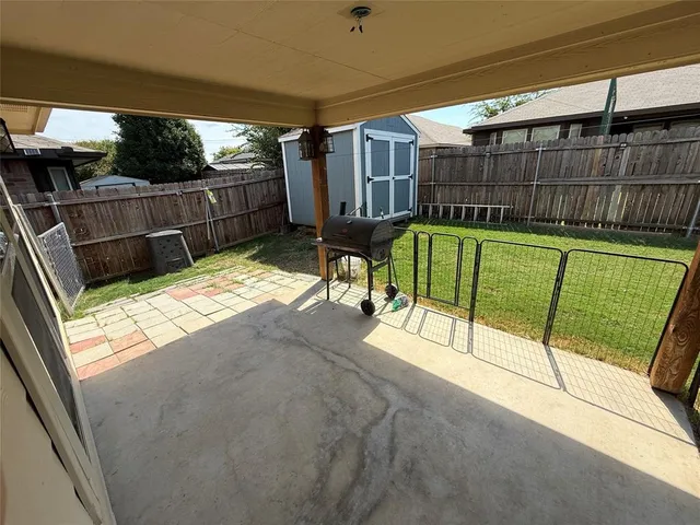 a view of a backyard with a patio