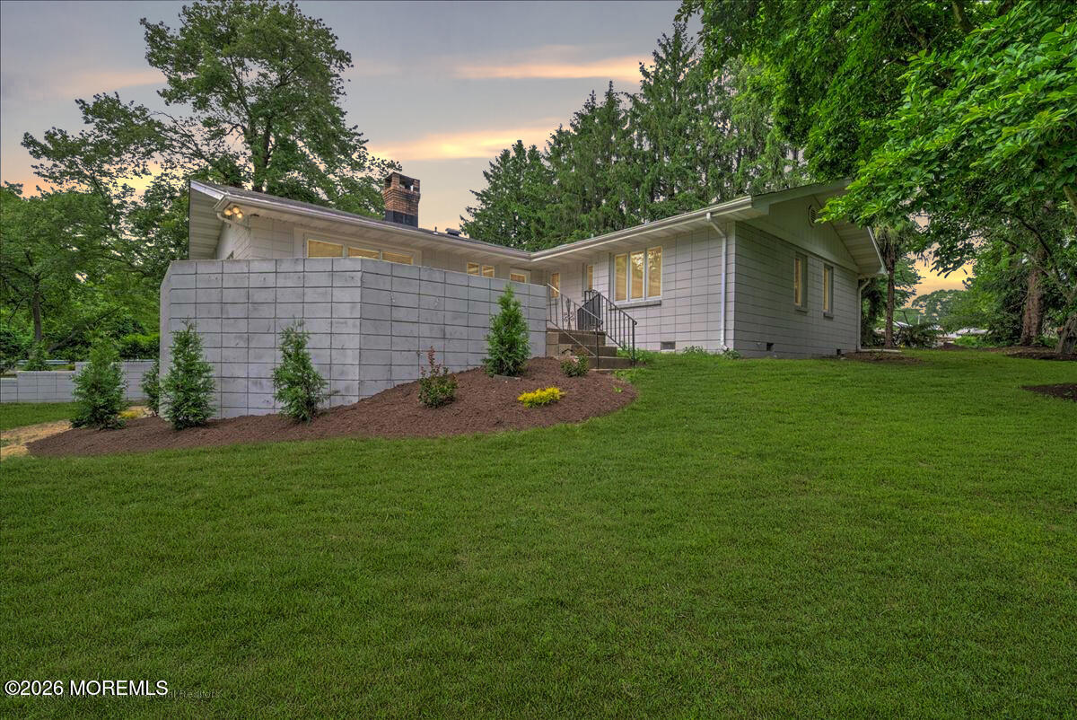699 Aldrich Road Howell, NJ 07731 - Photo 21 of 23 a backyard of a house with table and chairs