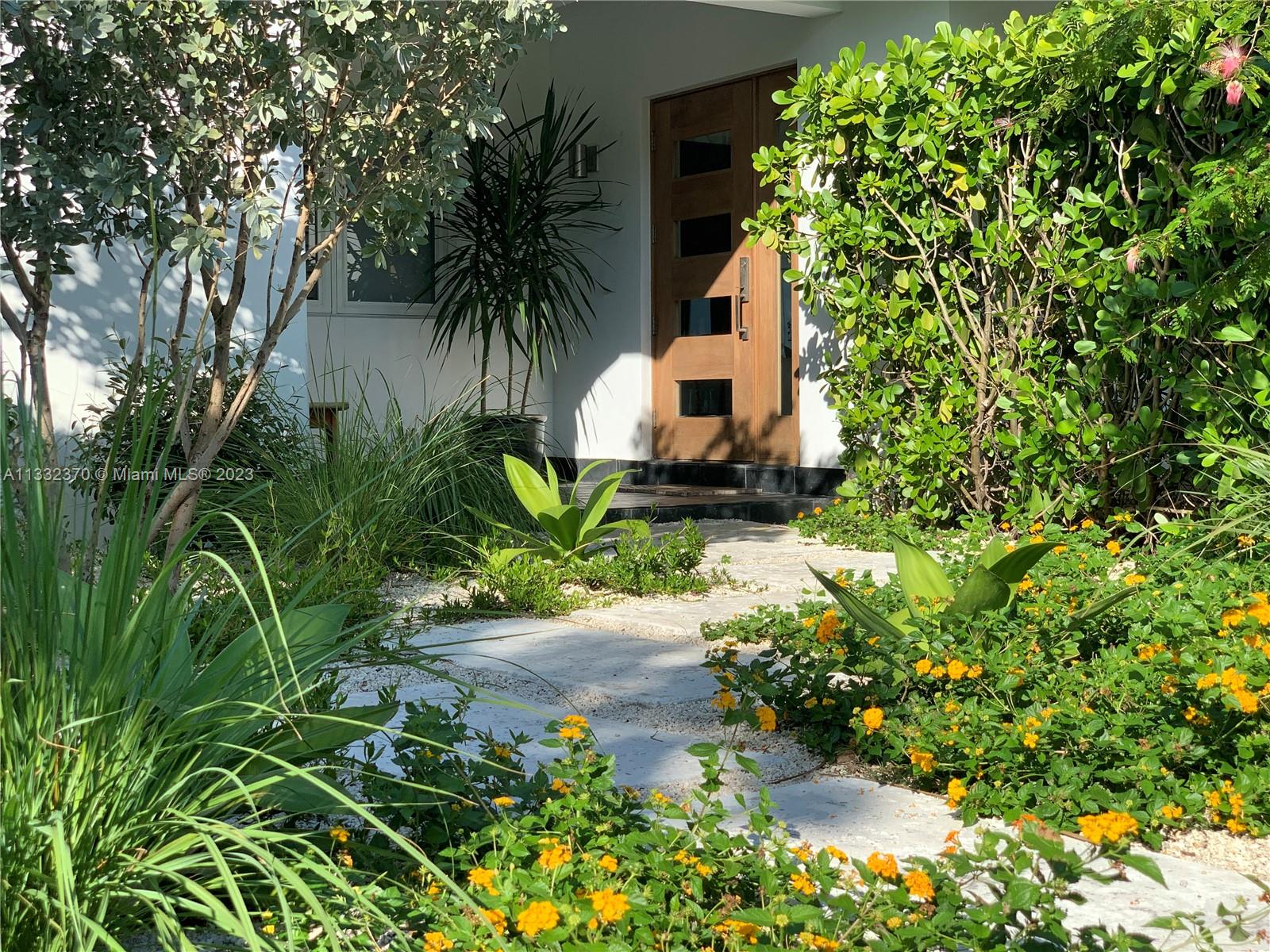 280 Hampton Lane Key Biscayne, FL 33149 - Photo 1 of 30 a plant that is in front of a house