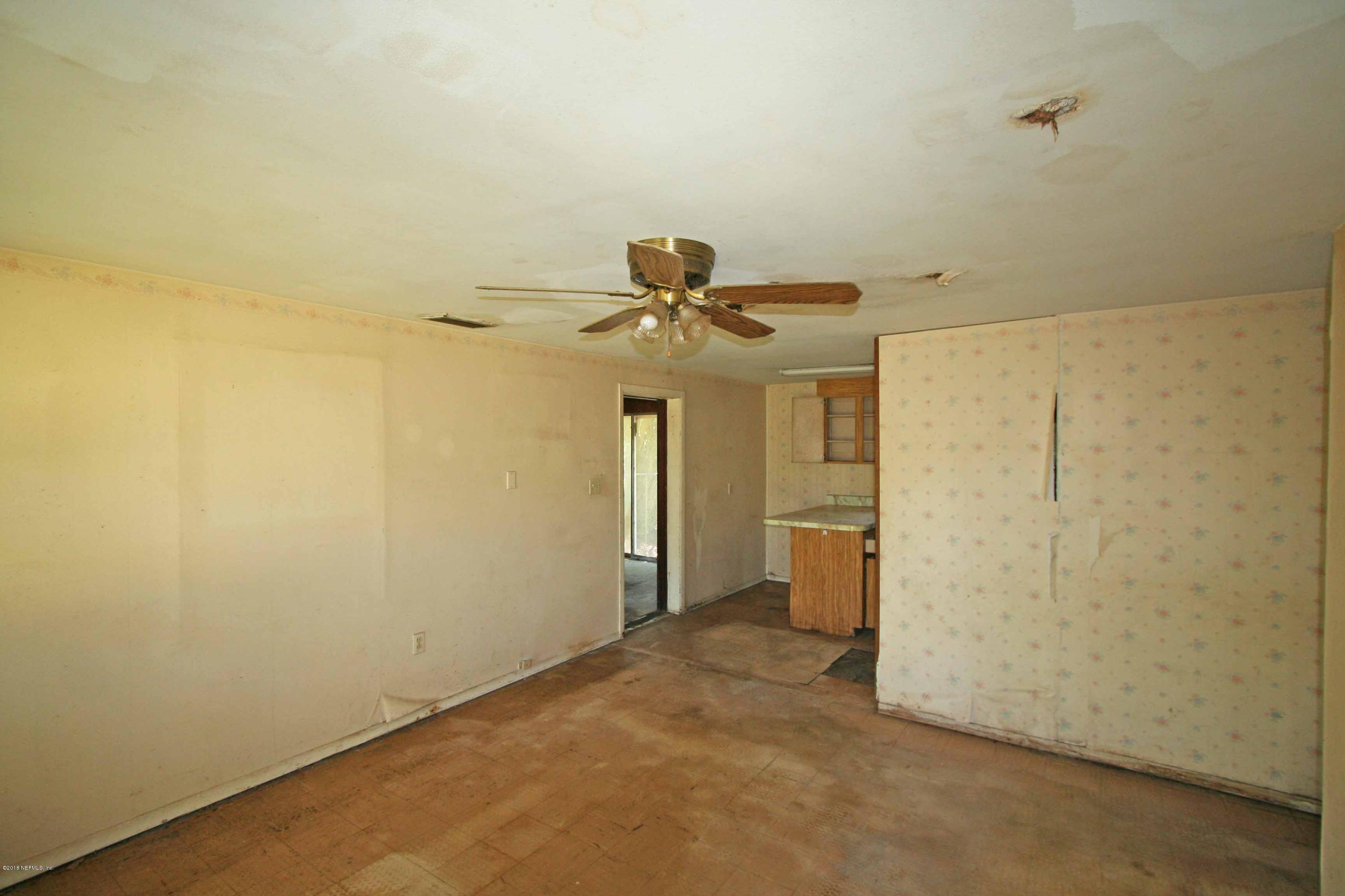 5569 Long Branch Road Jacksonville, FL 32234 - Photo 3 of 9 a view of a storage & utility room with a sink