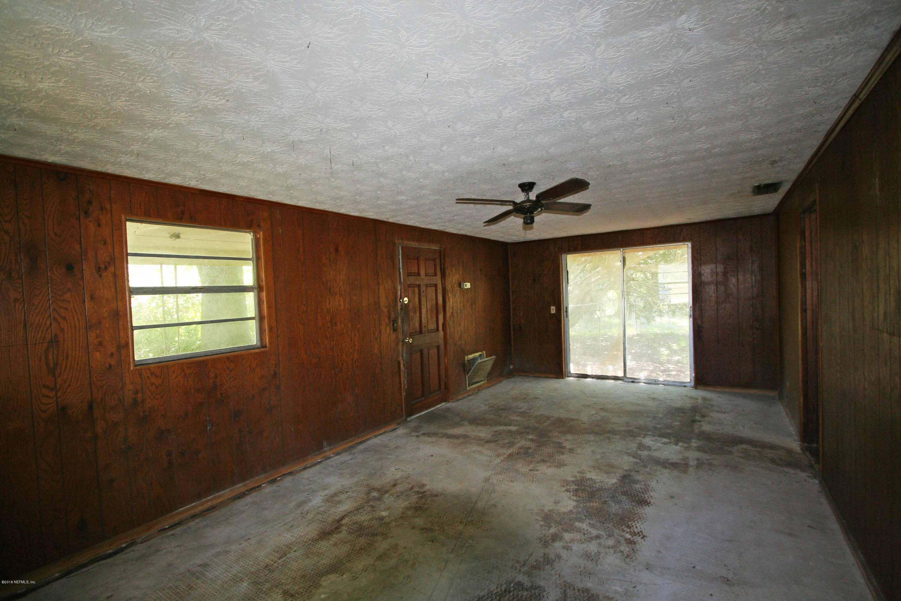 5569 Long Branch Road Jacksonville, FL 32234 - Photo 5 of 9 a view of an empty room with a window
