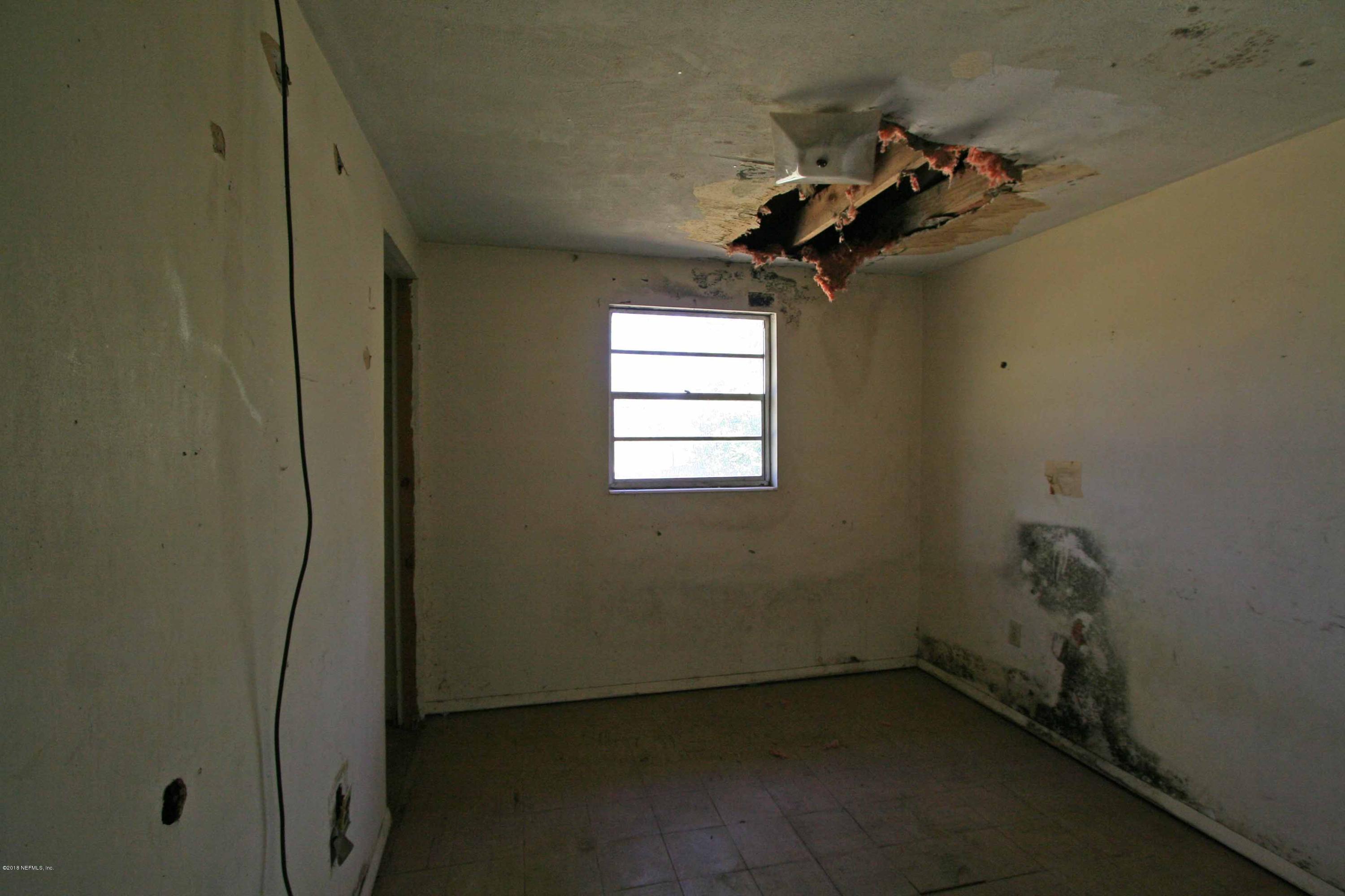 5569 Long Branch Road Jacksonville, FL 32234 - Photo 8 of 9 a view of a room that has a window in it