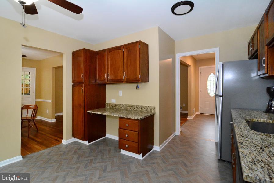 7610 Hayfield Road Alexandria, VA 22315 - Photo 10 of 28 View out of kitchen into dining room and foyer