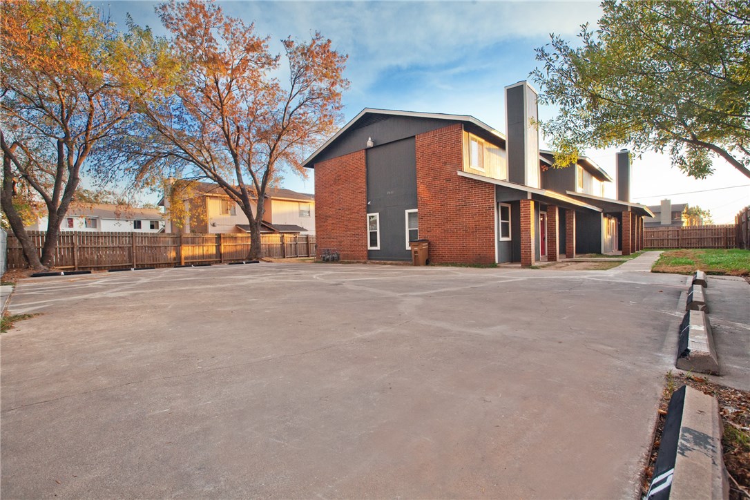a view of a building with a yard