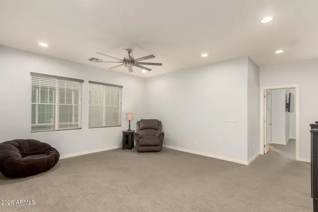 a living room with furniture and windows